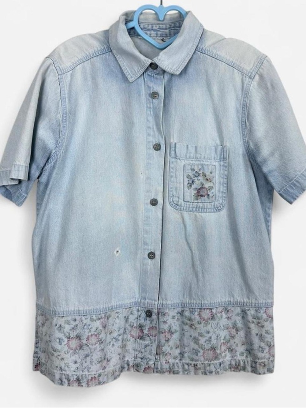 Vintage worn and faded light blue denim button up shirt with floral details